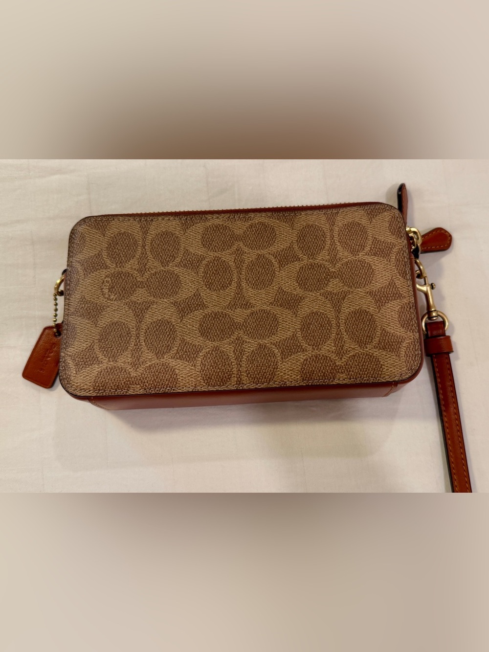 Kira Coach Signature Canvas Wristlet in Brown